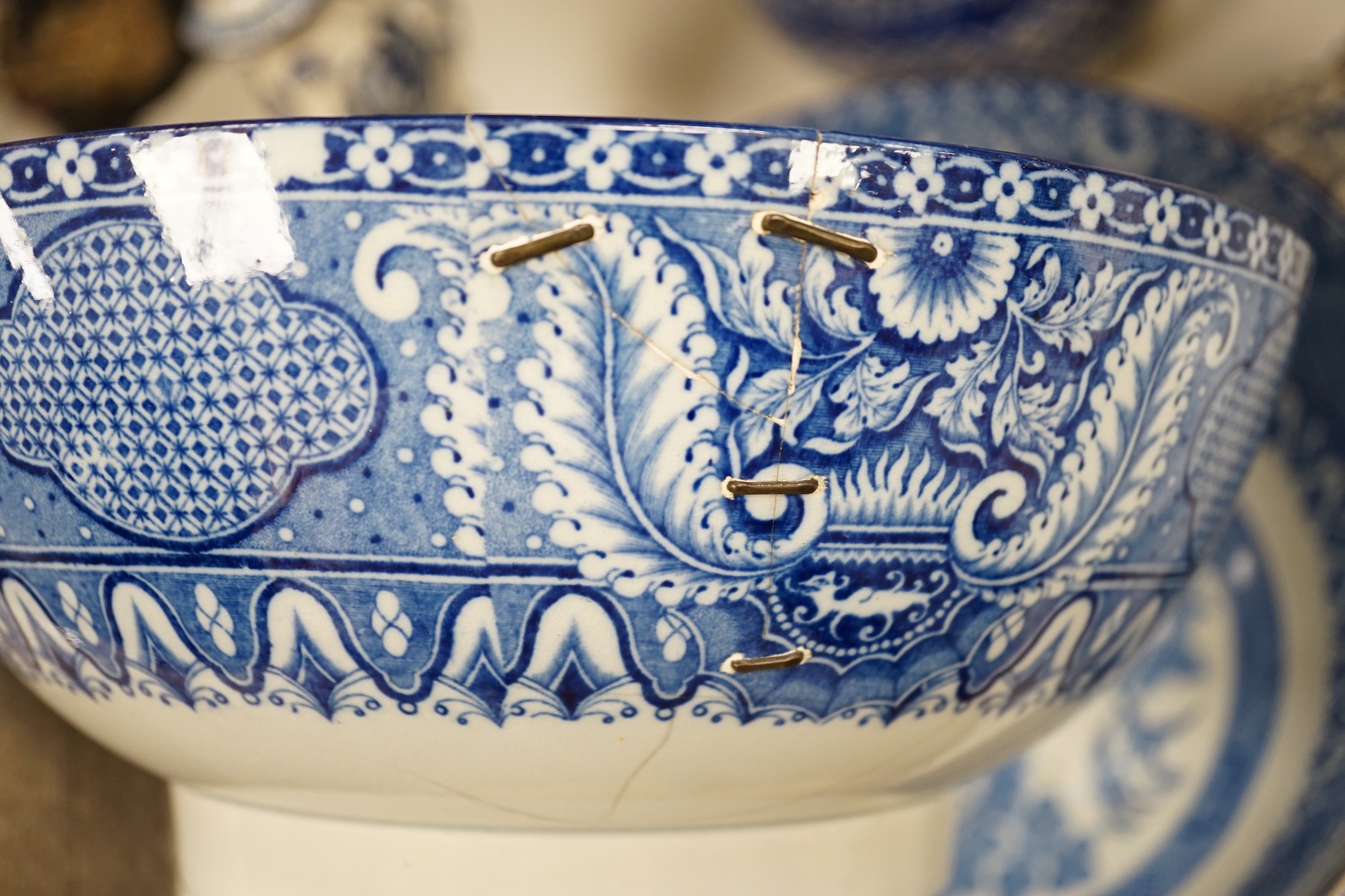 A pair of Delft blue and white candlesticks together with an 18th century Delft bowl, a Moroccan pottery jar with cover, and two pearlware bowls